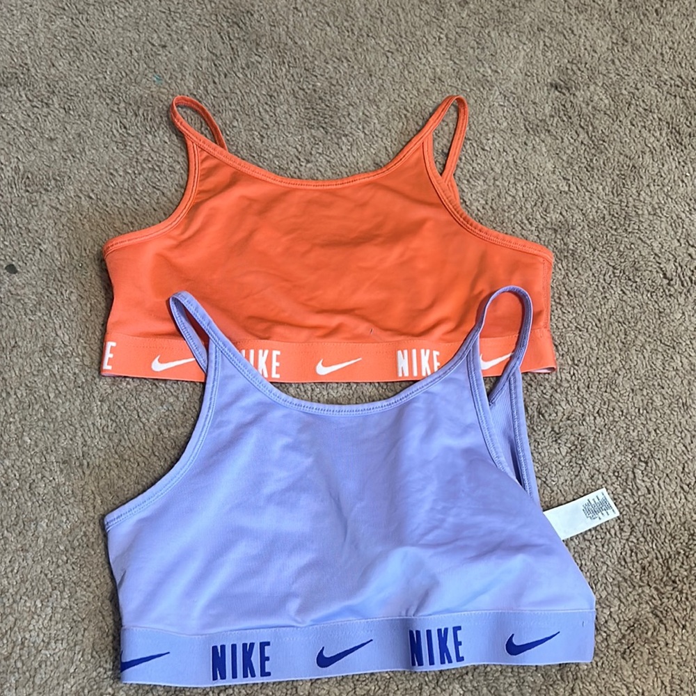 Bundle of pink and purple sports bras